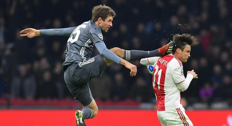 Bayern Munich striker Thomas Mueller is suspended for both legs of their Champions League last 16 matches against Liverpool for this kick on Ajax's Argentine defender Nicolas Tagliafico during December's 3-3 draw in Amsterdam in the group stages.