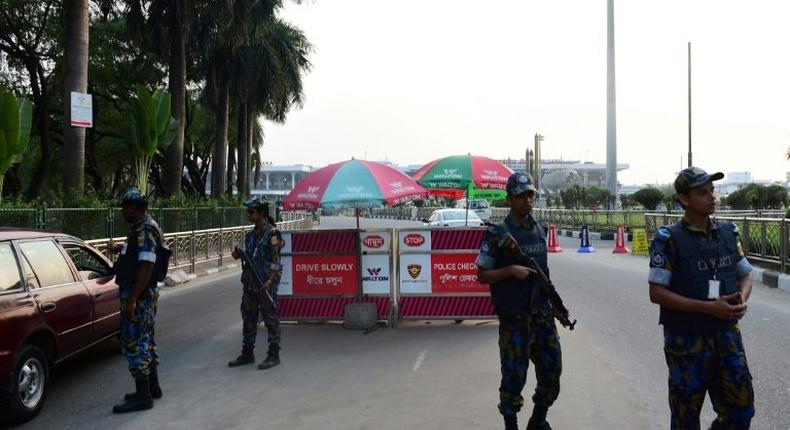 Bangladesh security personnel guard the entrance of Hazrat Shah Jalal International Airport in Dhaka on March 17, following a suicide bomb attack on a military camp in the city