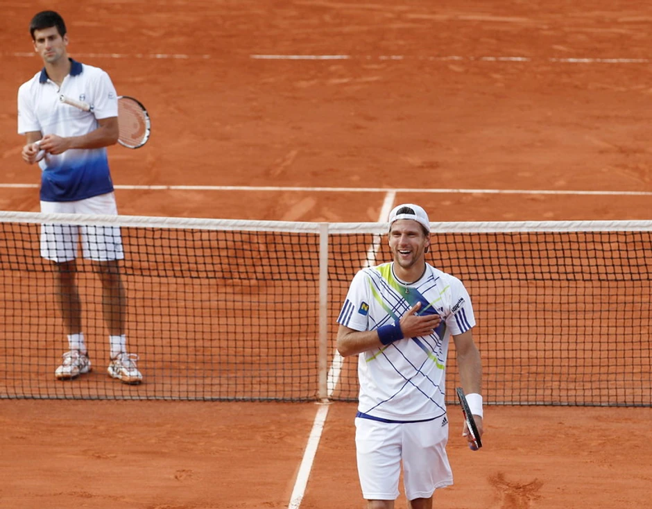 Jirgen Melcer i Novak Đoković