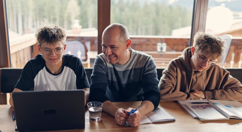 The author (not pictured) is a financial writer but isn't teaching his kids about investing yet.Imgorthand/Getty Images