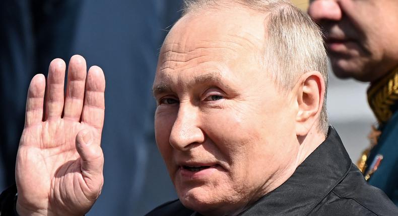 Russian President Vladimir Putin leaves Red Square after the Victory Day military parade in central Moscow on May 9, 2022