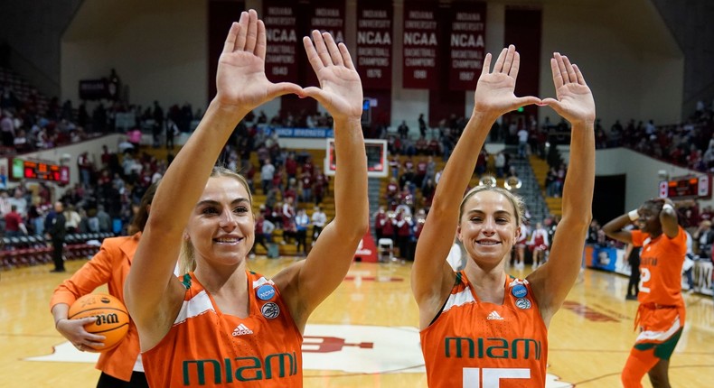 Miami's Haley Cavinder and Hanna Cavinder celebrate following a second-round college basketball game against Indiana.AP Photo/Darron Cummings