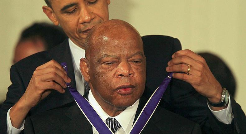 U.S. Rep. John Lewis (D-GA) (R) is presented with the 2010 Medal of Freedom by President Barack Obama during an East Room event at the White House February 15, 2011 in Washington, DC.