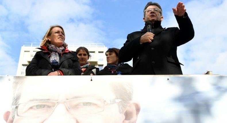 French presidential election candidate for the far-left coalition La France insoumise Jean-Luc Melenchon, speaks next to Left Party's coordinator Dannielle Simonnet aboard an unbowed barge on the Canal Saint-Martin on April 17, 2017 in Paris