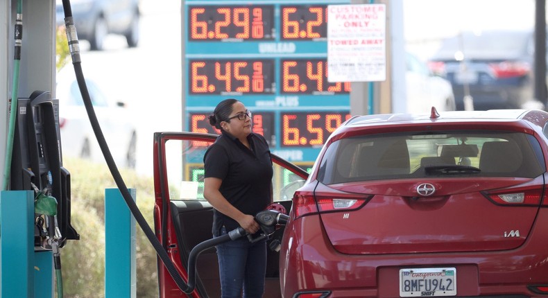 A customer pumps gas into their car at a gas station on May 18, 2022 in Petaluma, California.