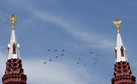 MIG-29 and SU-25 military jets fly in formation during the Victory Day parade above Red Square in Moscow