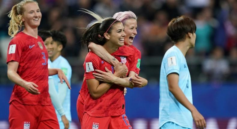 Alex Morgan (2nd right) celebrated her five-goal haul with Megan Rapinoe