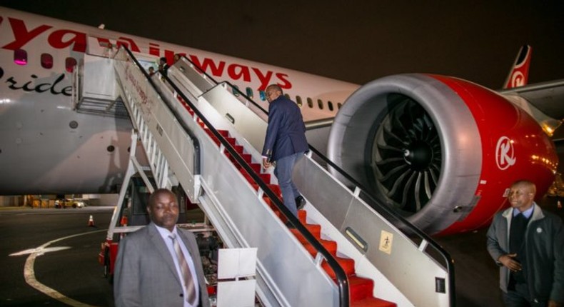 File image of President Uhuru Kenyatta boarding a Kenya Airways plane