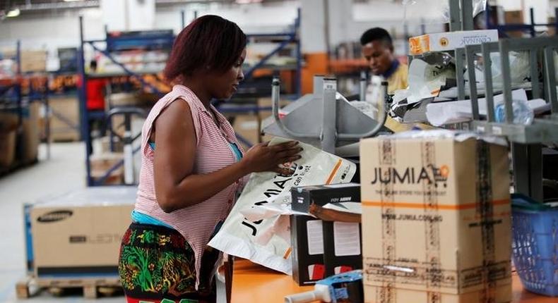 A woman works at the packaging unit at a warehouse for an online store, Jumia in Ikeja district, in Nigeria's commercial capital Lagos June 10, 2016.