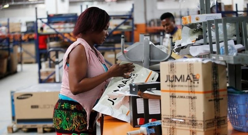 A woman works at the packaging unit at a warehouse for an online store, Jumia in Ikeja district, in Nigeria's commercial capital Lagos June 10, 2016.