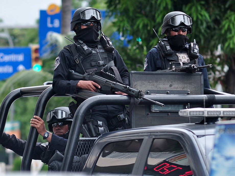 Federal police patrol during a security operative to prevent riots in Acapulco, Mexico, on October 16, 2014.