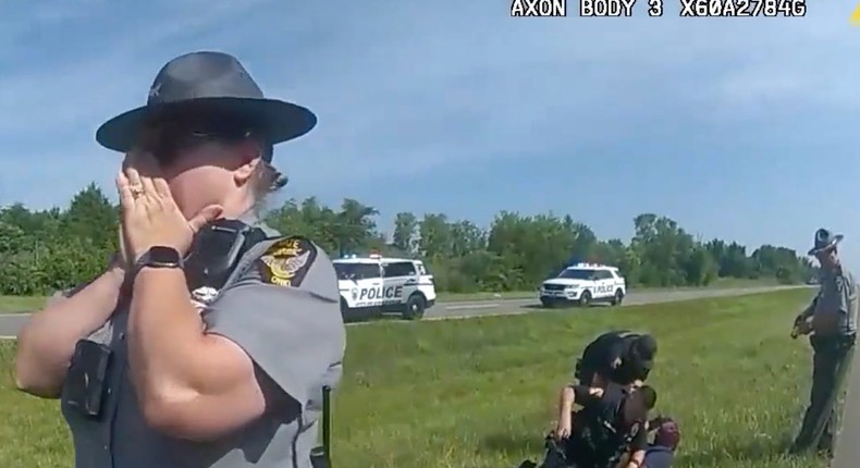 An Ohio state trooper appears shocked after a police dog mauled Jadarrius Rose, body camera footage shows.Ohio State Highway Patrol