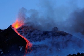 Italy's Mount Etna, Europe's tallest and most active volcano, spews lava as it erupts on the souther