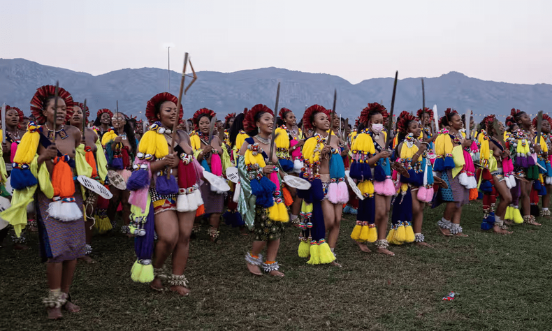 Nomcebo Zuma (3rd L) and one of the king’s daughters, Princess Sakhizwe (2nd L), sing and dance with other young women during the Umhlanga reed dance. Photograph: Emmanuel Croset/AFP/Getty Images