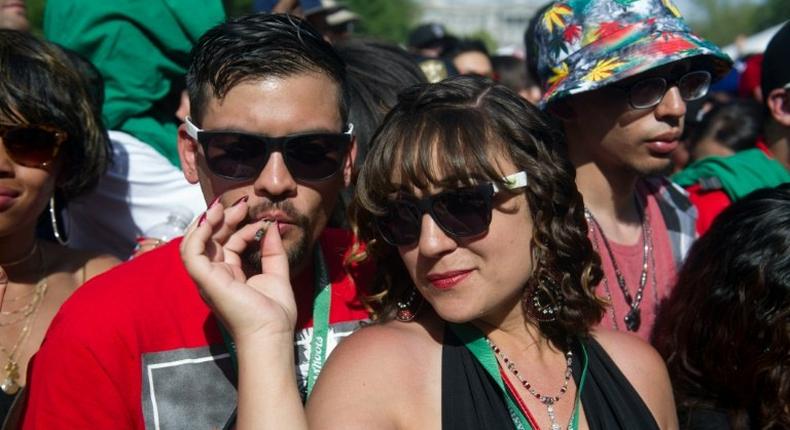 People attend the Denver 420 Rally, the world's largest celebration of both the legalization of cannabis and cannabis culture, in May, in Denver Coloroado