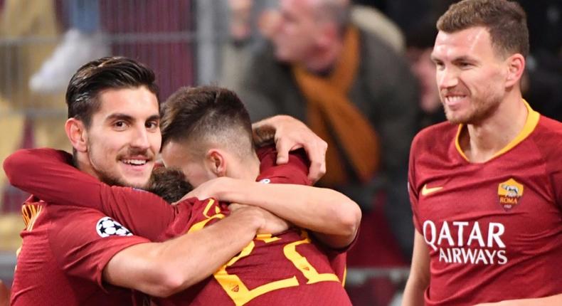 Lorenzo Pellegrini (L) and Edin Dzeko (R) fired in two quickfire goals for Roma
