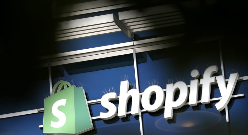 FILE PHOTO: The logo of Shopify is seen outside its headquarters in Ottawa, Ontario, Canada, September 28, 2018. REUTERS/Chris Wattie