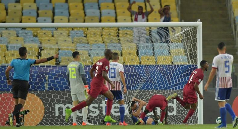 Qatar's players celebrate after Boualem Khoukhi scores the equalizer in their 2-2 Copa America draw with Paraguay