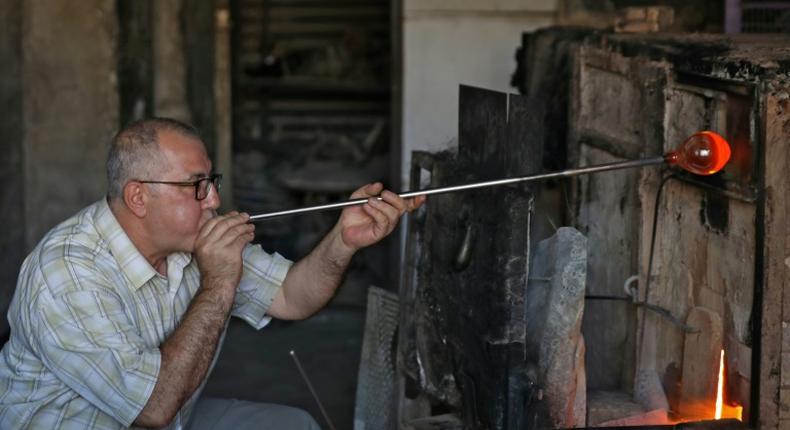 Mohamed al-Hallak and his brothers are the last family to keep up the tradition of glass-blowing in Syria's capital Damascus, according to a craft association