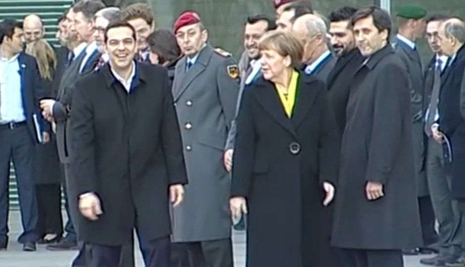 Džordž Čoularakis, na slici desno od Angele Merkel