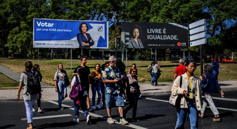 Anti-racism activist Joacine Katar Moreira, seen on the billboard on the right, is the best-known of the three new lawmakers