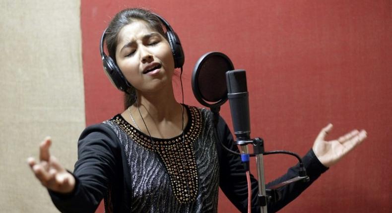 Indian singer Ginni Mahi sings songs set against Punjabi dance beats, exhorting pride in her Dalit roots