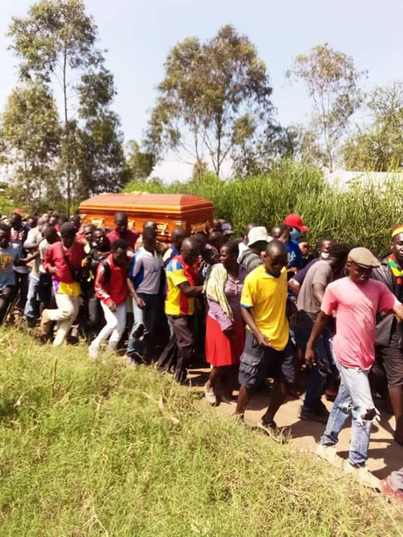Mourners carrying the remains of Ohangla musician Abenny Jachiga
