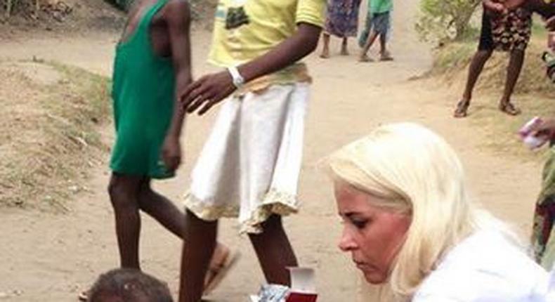 Pictures show woman rescue a 2-yr-old boy accused of being a witch in Nigeria