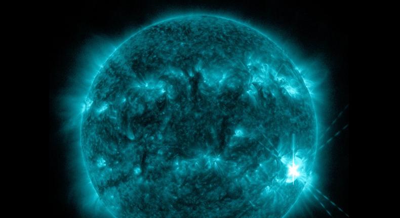 An X-class flare erupts on the sun (lower right), emitting a burst of electromagnetic radiation, on March 28, 2022 Eastern Time.NASA Solar Dynamics Observatory