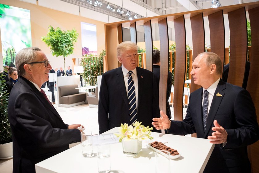 U.S. President Donald Trump and Russia's President Vladimir Putin shake hands during the G20 Summit 