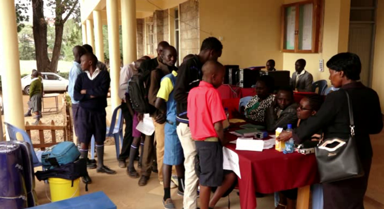 Parents and students during the Form 1 admission process at a Kenyan secondary school (Twitter)