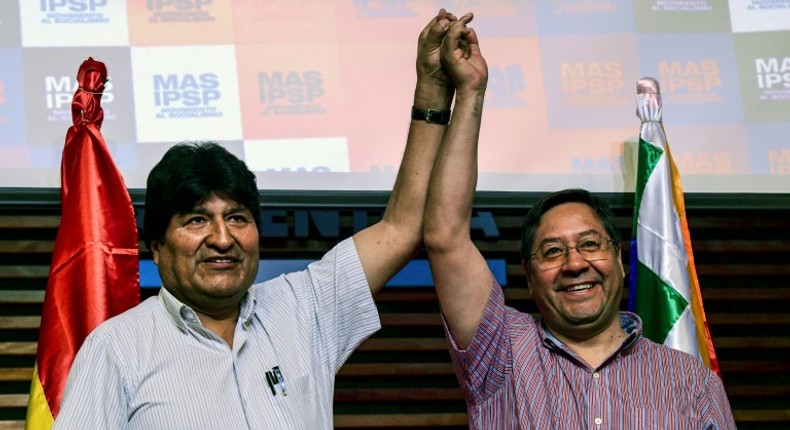 Bolivia's ex-President Evo Morales (L) with the candidate for his Movement for Socialism (MAS) party, Luis Arce, at a press conference in Buenos Aires