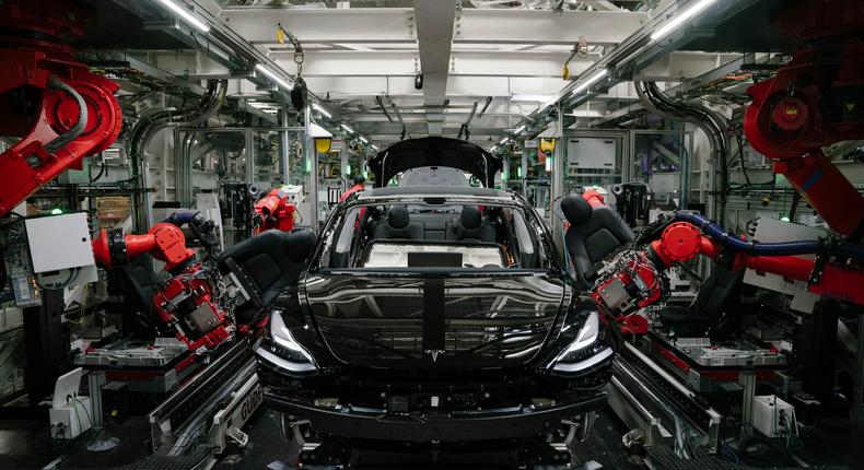 Robotics arms installing the front seats to the Tesla Model 3 at the Tesla factory in Fremont, California.Mason Trinca/The Washington Post via Getty Images