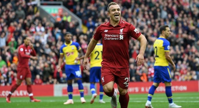 Swiss bliss: Xherdan Shaqiri celebrates after Southampton defender Wesley Hoedt scores an own goal