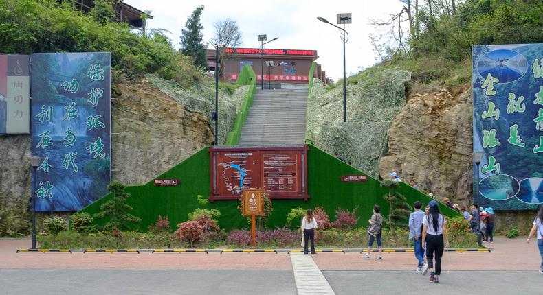 The Zhangjiajie Grand Canyon Glass Bridge is located in the mountainous province of Hunan in southern China. It's a 45-minute bus ride from Wulingyuan, a scenic town at the base of the stunning Wuling Mountain Range, where most tourists stay.