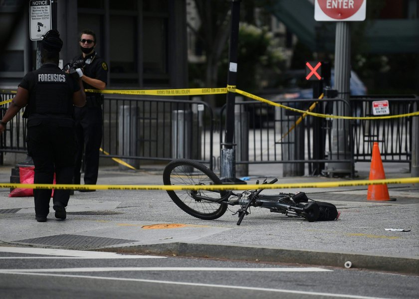 Police officers stop a suspect after a shooting incident outside of the White House, in Washington