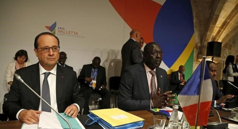 French President Francois Hollande (L) and Gambia's trade minister Abdoulie Jobe attend the Valletta Summit on Migration in Valletta, Malta, November 12, 2015. REUTERS/Darrin Zammit Lupi