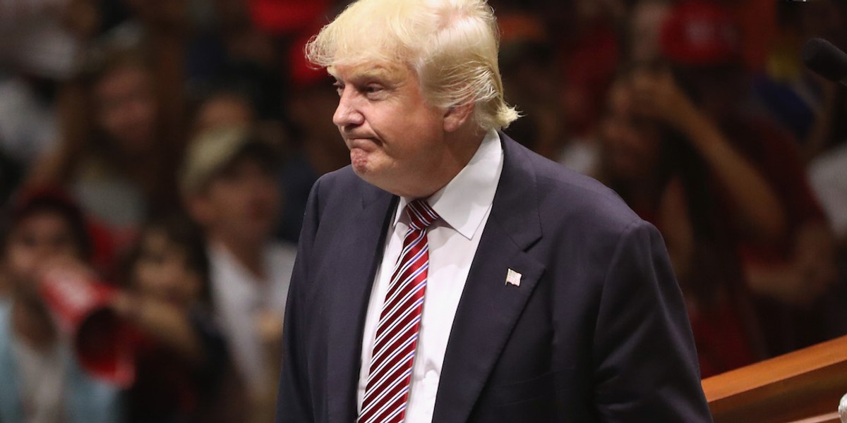 Republican Presidential nominee Donald Trump watches as a protester is ejected on August 23, 2016 in Austin, Texas