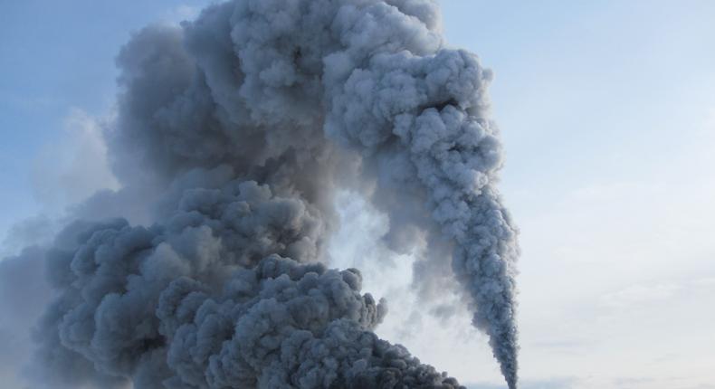 Clouds of smoke billow out of a borehole created when scientists accidentally drilled into a magma chamber in 2009.KMT