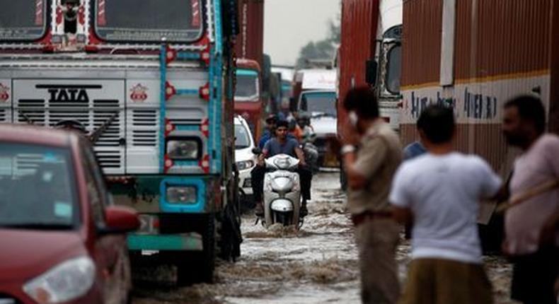 Monsoon deluge in Indian cities causes traffic chaos, sewage swirls