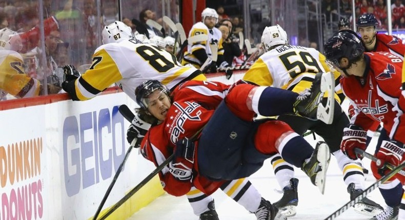 Sidney Crosby (No. 87) of the Pittsburgh Penguins checks T.J. Oshie of the Washington Capitals in Game Five of the NHL Eastern Conference 2nd round, at the Verizon Center in Washington, DC, on May 6, 2017