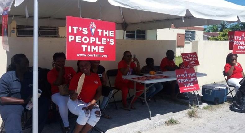 About 180,000 people are registered to cast votes in the Bahamas' election. Supporters of the Free National Movement (FNM) are shown here gathered at a polling station in Nassau