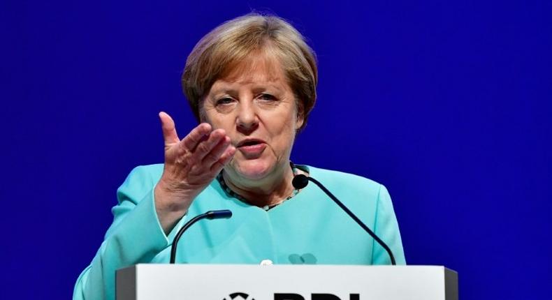 German Chancellor Angela Merkel makes an overture to new French President Emmanuel Macron by saying she is open to considering his ideas to reform the eurozone