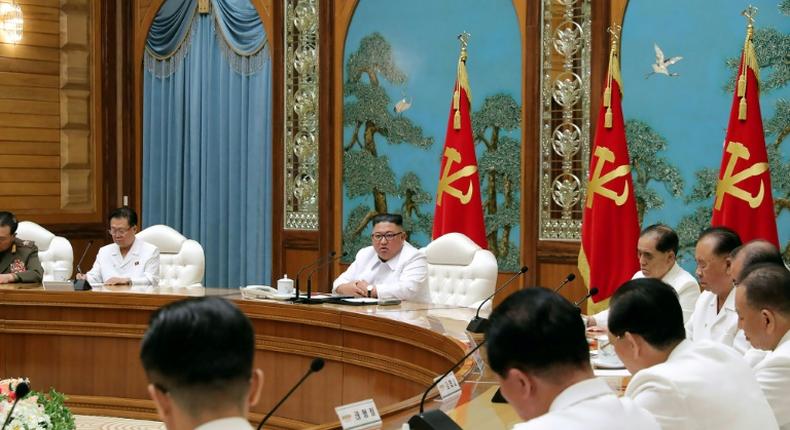North Korean leader Kim Jong Un convened an emergency politburo meeting on Saturday to implement a maximum emergency system and issue a top-class alert to contain the virus, official news agency KCNA said