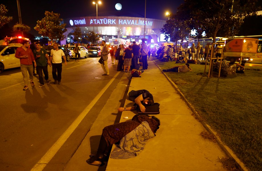 People leave Turkey's largest airport, Istanbul Ataturk, after a blast on June 28.