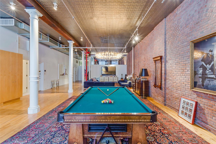 Levine and Prinsloo have eclectic taste, as evidenced by this giant pool table which gets a central spot in the loft.