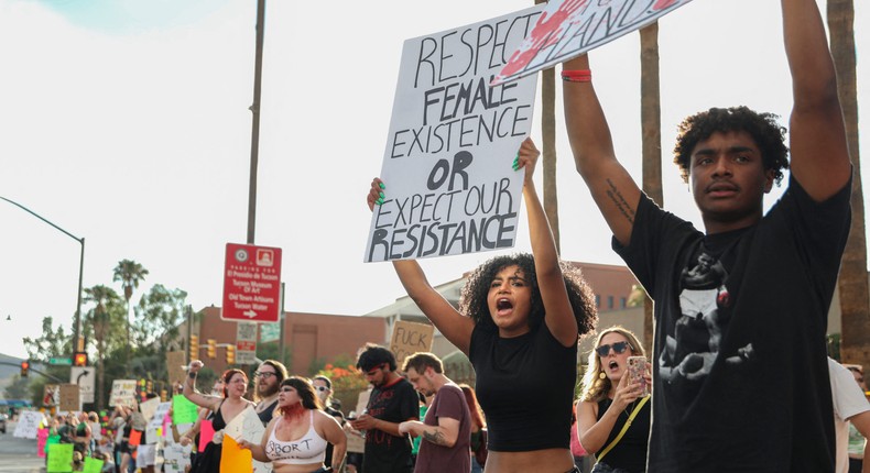 Abortion rights activists hold up signs outside the Tucson Federal Courthouse in 2022.Sandy Huffaker/Getty Images