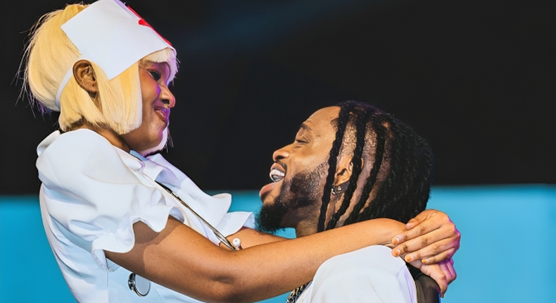 Diamond Platnumz with Zuchu on stage at a past event 