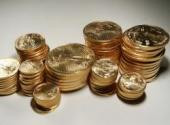 Amerykańskie monety, American Eagle o wadze 1 uncji oraz 1/2, 1/4 i 1/10 uncji. Fot. Bloomberg