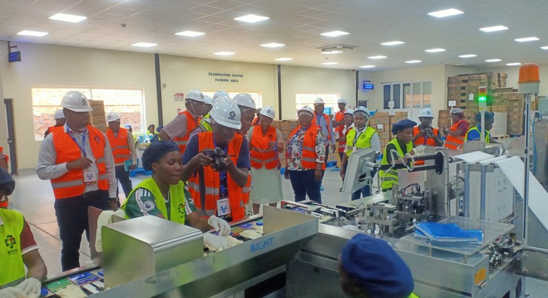 MPs touring a production line at the East African Medical Vitals